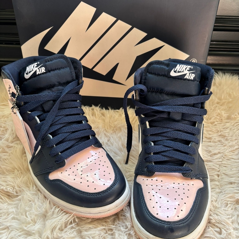 Pink and navy hightop Nike sneakers